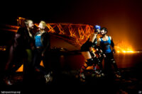 Couple portrait with roller skates and Forth Bridge. Light painted photograph.