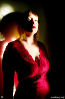 Woman in a red dress. Light painting photograph.