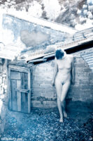Female figure nude in derelict building. Infrared photograph.