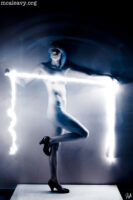 Figure nude with glowing filament. Infrared light painted photograph.