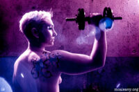 Woman with tattoo and barbell. Infrared photograph.