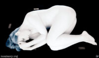 Foetal position figure nude. Infrared photograph.