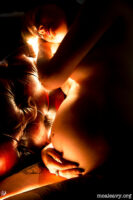 Reclining pregnant figure nude. Light painted photograph.